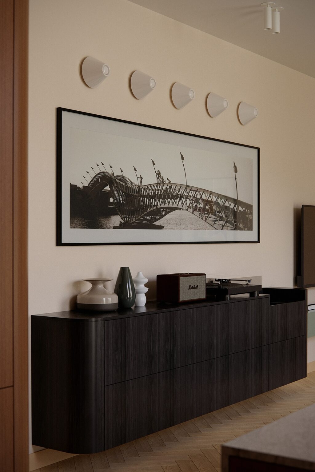 black console table and vintage print artwork