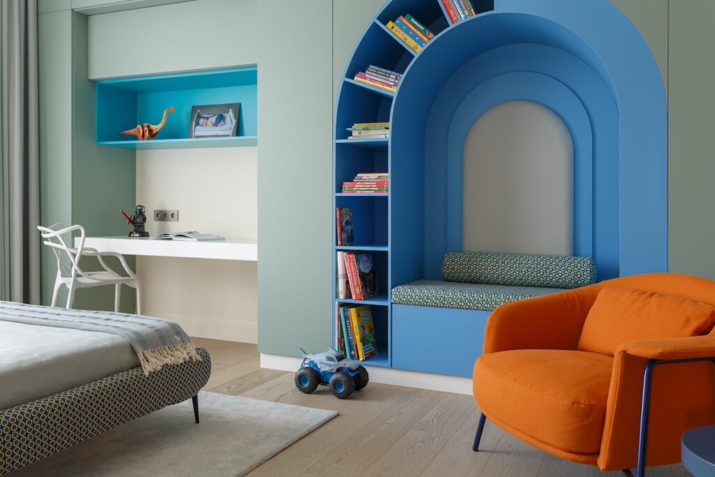 blue alcove seating with built in bookshelves