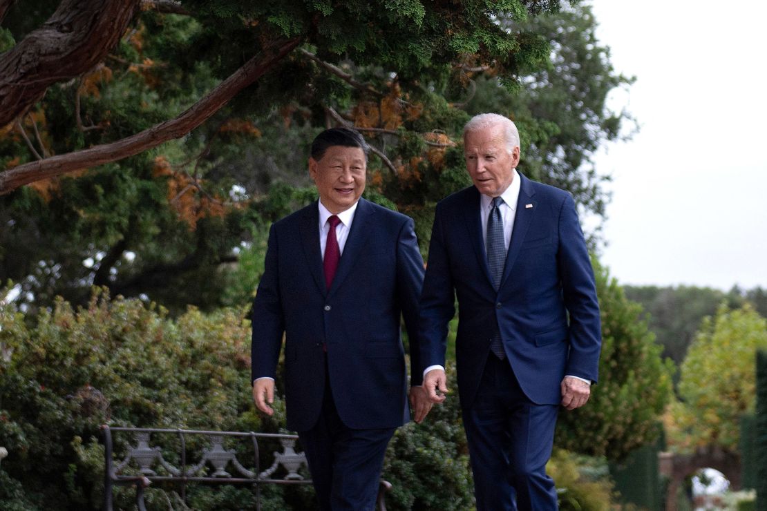 Chinese leader Xi Jinping and US President Joe Biden walk together after a meeting on the sidelines of the Asia-Pacific Economic Cooperation Leaders