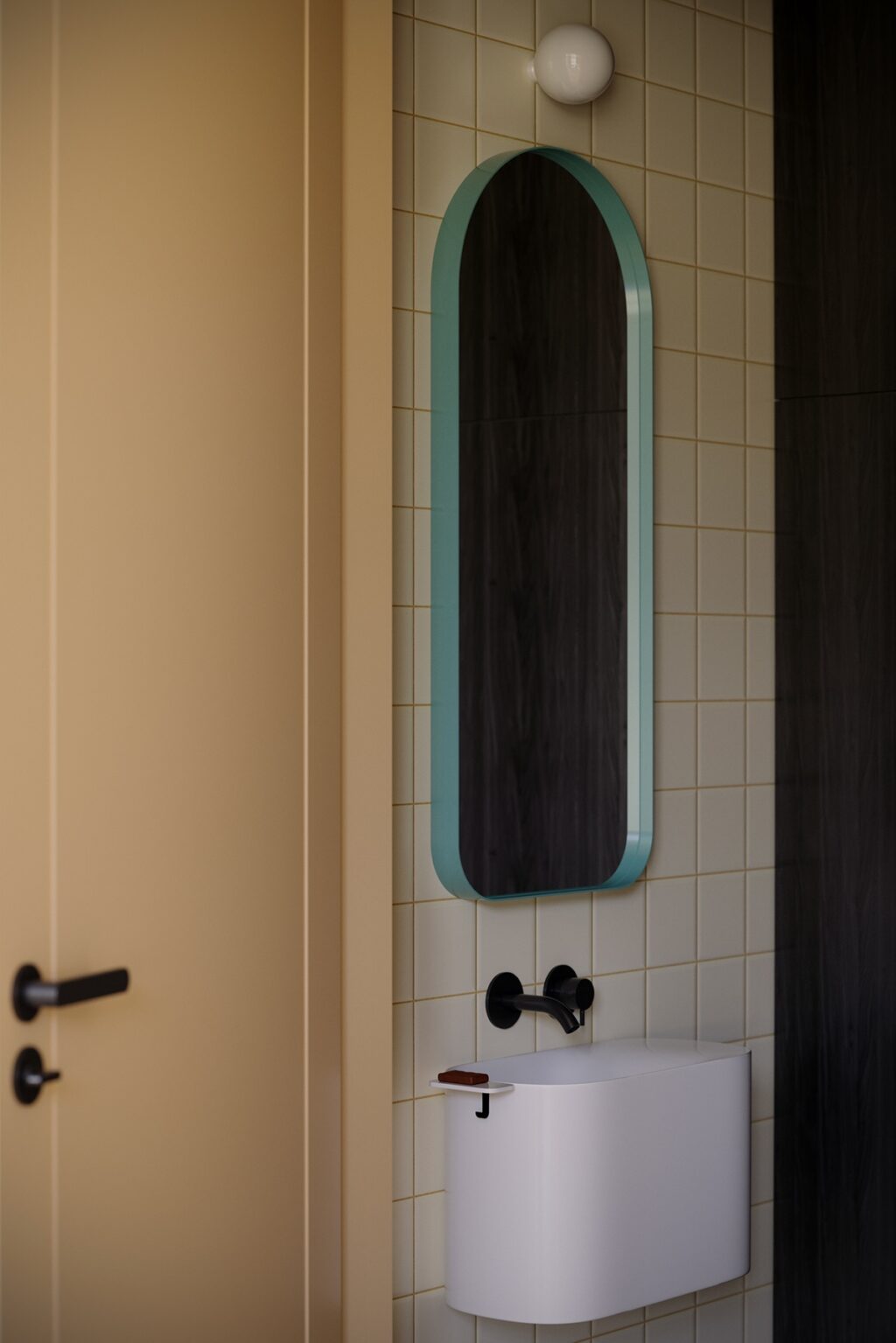 wall mounted sink and mirror in bathroom