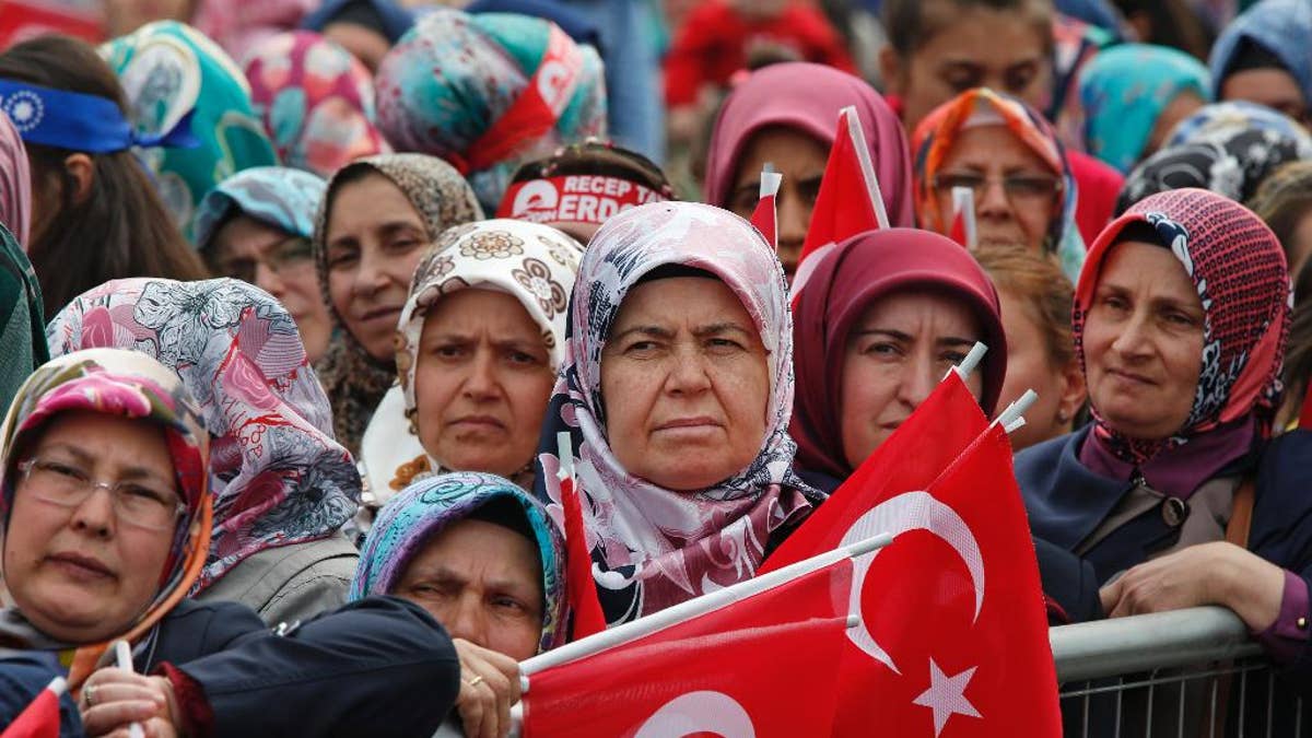 FILE - In this May 30, 2015, file photo, supporters of Turkey