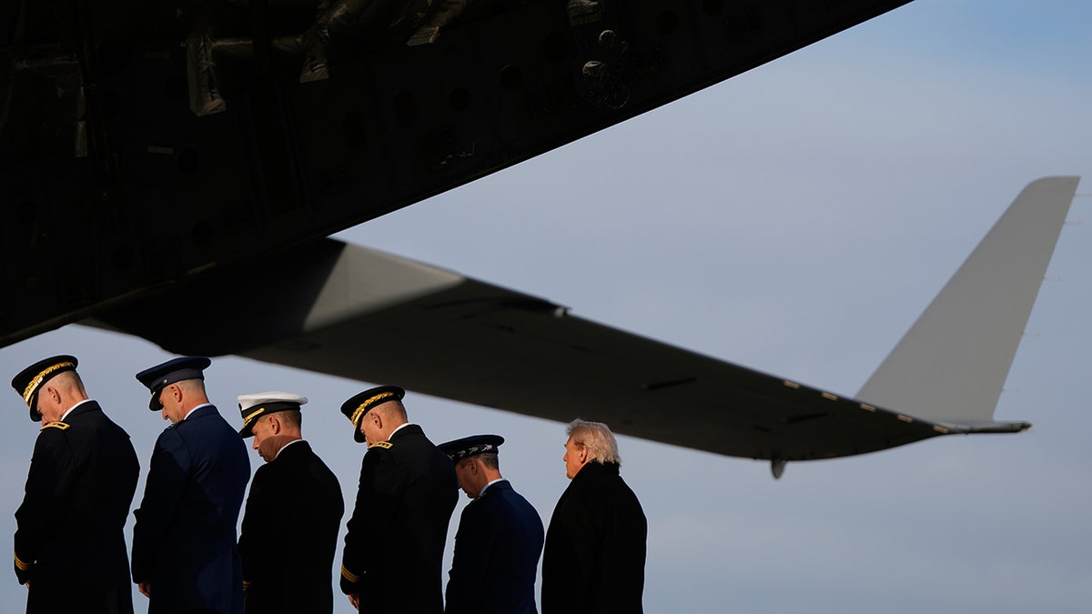 President Trump watches as fallen soldiers return home
